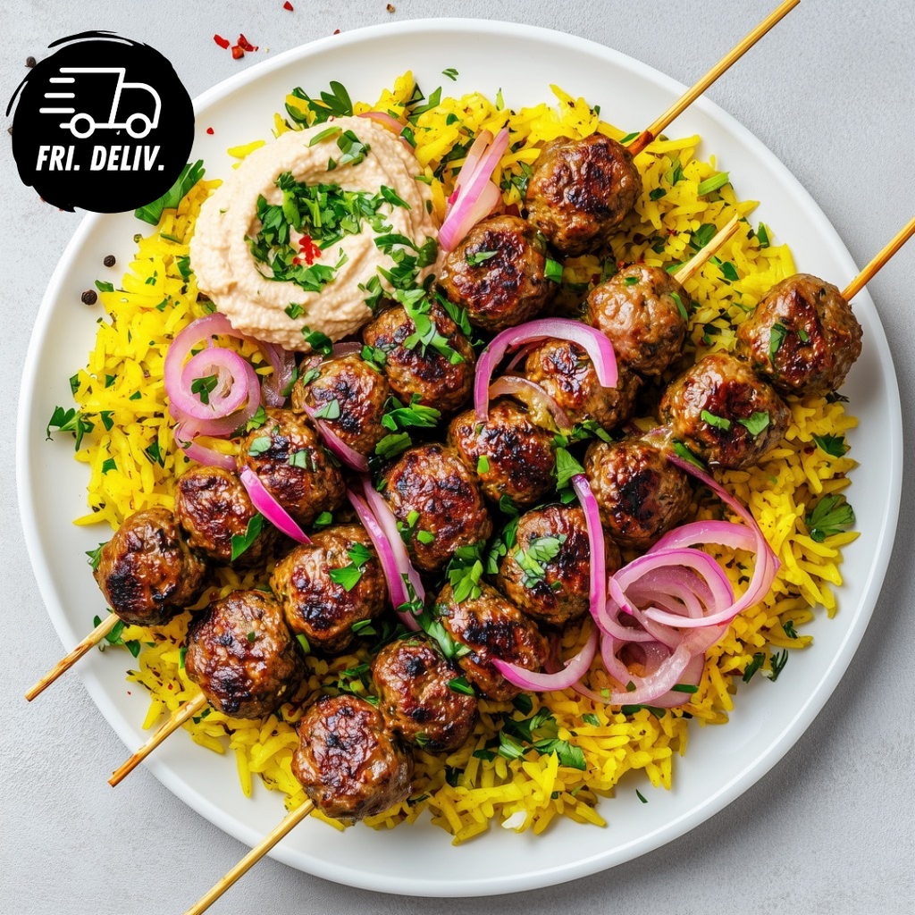 SPICED LAMB KOFTA WITH RICE PICKLED ONION AND TAHINI SAUCE.